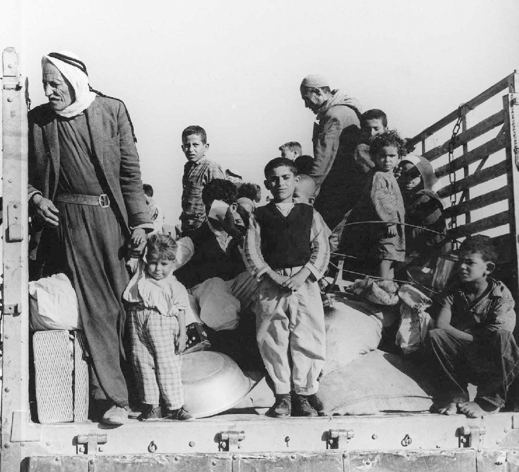 Palestinian refugees being trucked out of their village, circa 1948.