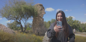 Screen grab from video showing a girl talking on mobile phone.